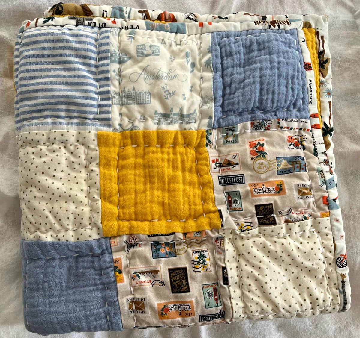 685bf416c0f3f4673dfe2462_little-traveler-quilt-yellow_1788034263662.jpg